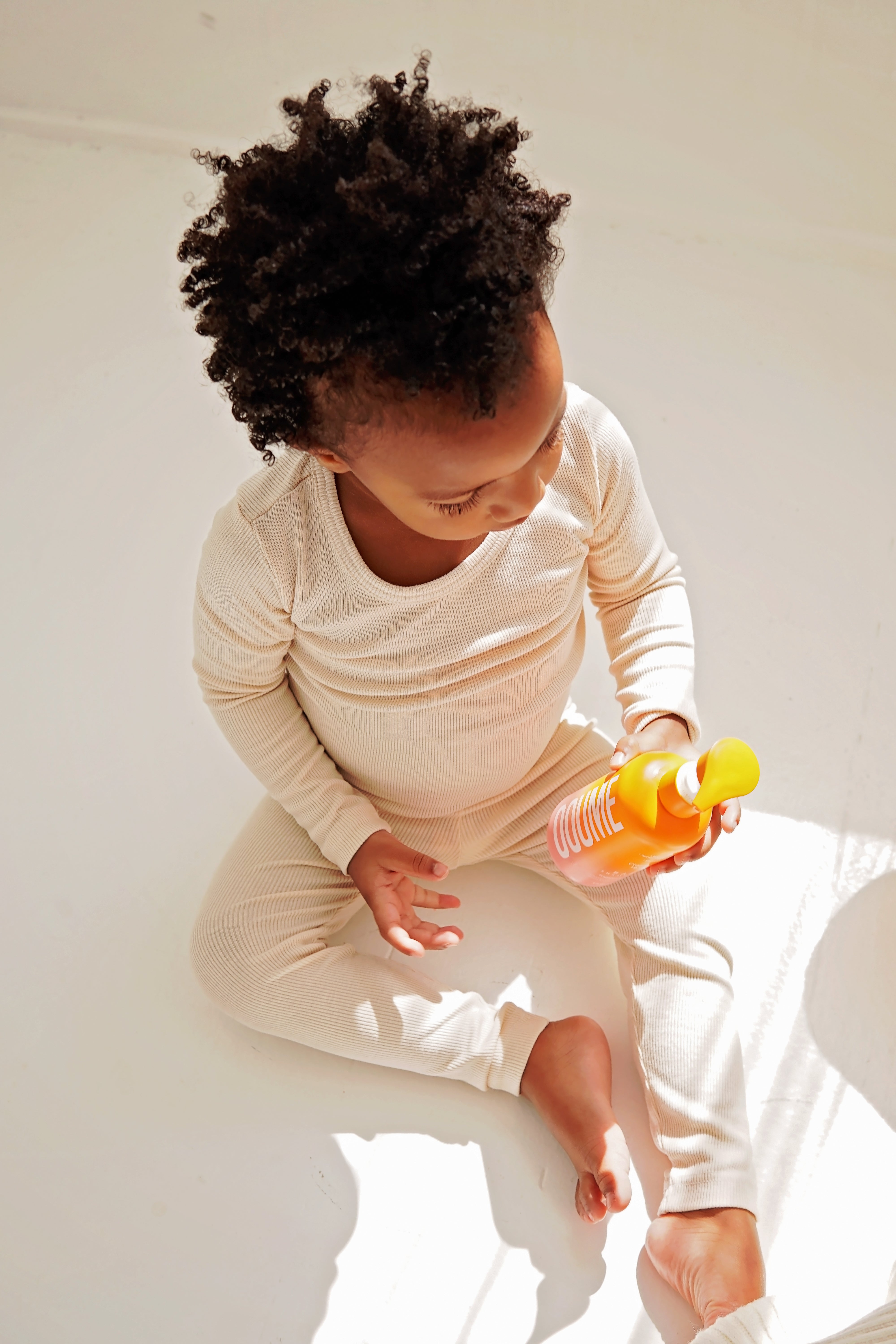 Baby conditioner bottle with gentle ingredients.